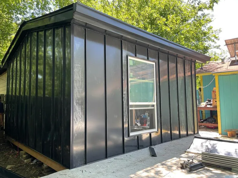 Black standing seam metal wall panels for Roof Inspection in Jasper